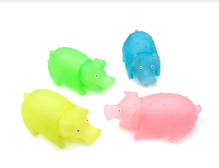 Juguete de chancho de goma con chifle y luz